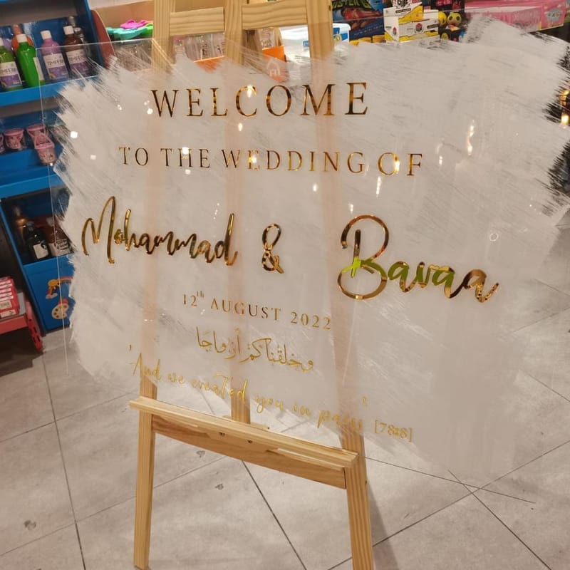 Acrylic wedding welcome sign with gold lettering and Quran verse for Mohammad and Baraa