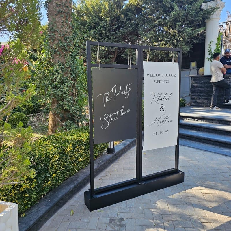 Elegant wedding welcome sign on metal frame stand for Khaleel and Madleen celebration