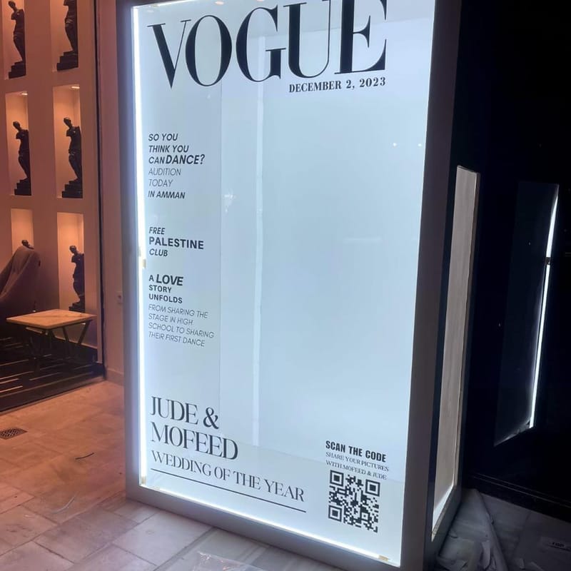 Custom backlit VOGUE magazine cover-style wedding display with QR code for Jude and Mofeed