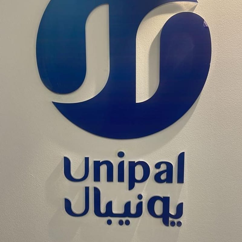 Premium 3D acrylic corporate logo sign for Unipal mounted on office wall